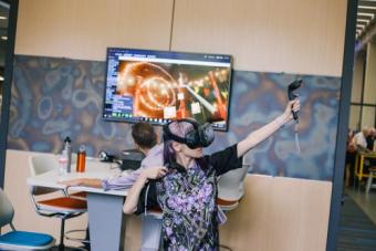 Student engaged in virtual reality gestures